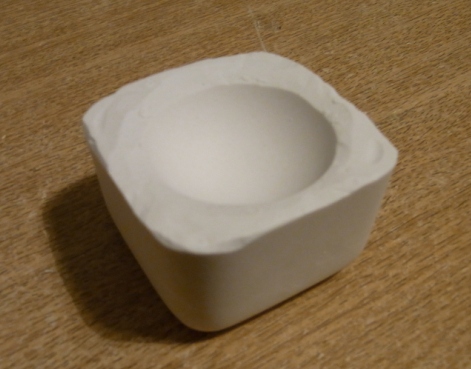 a plaster mold of a 'ping pong' ball