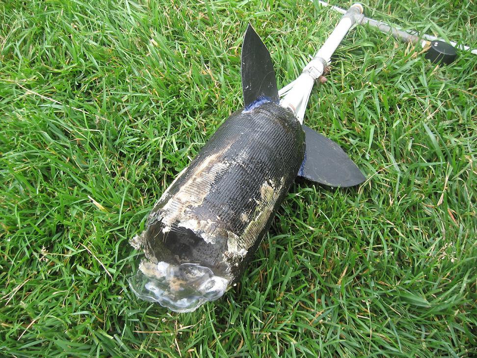 This one developed a pin hole leak, from hitting a tree branch, and we had to let it blow.  We were finished with fin configs. The hull was an incomplete design anyway.  The concussion broke the launcher and shoved the bore onto the launch tube another 2 inches and past a diameter, .200&quot; bigger then the bore ID.   lol